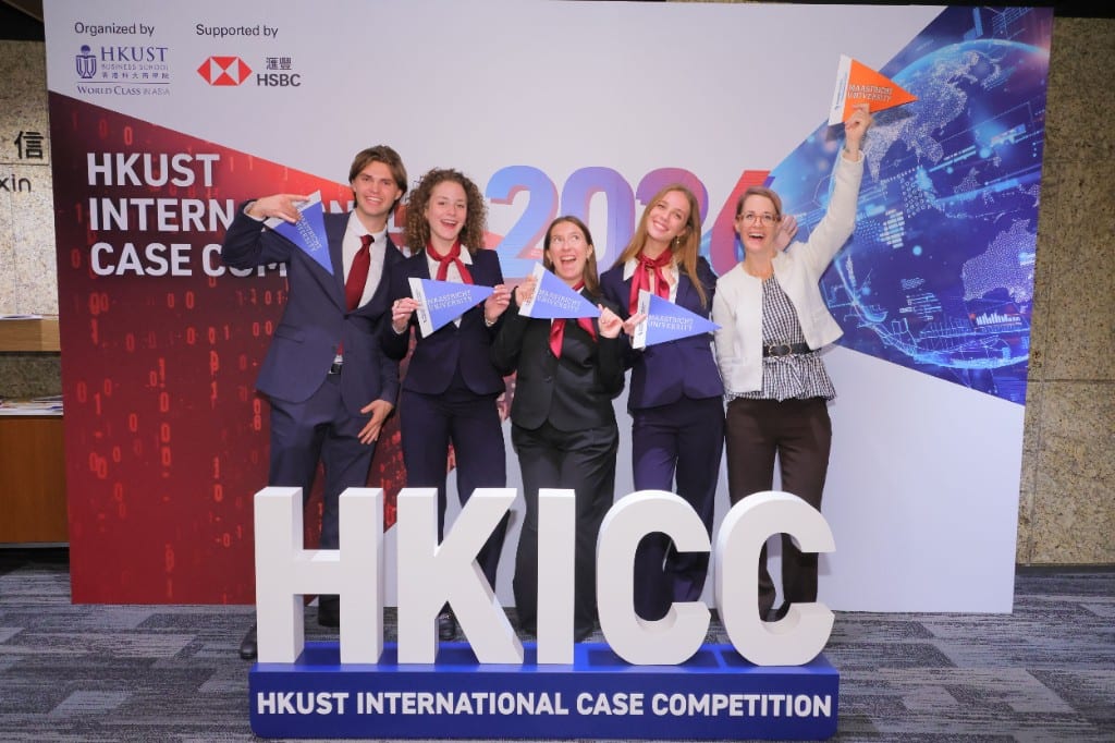 Maastricht University team at the HKUST International Case Competition 2026, holding university pennants behind HKICC letters