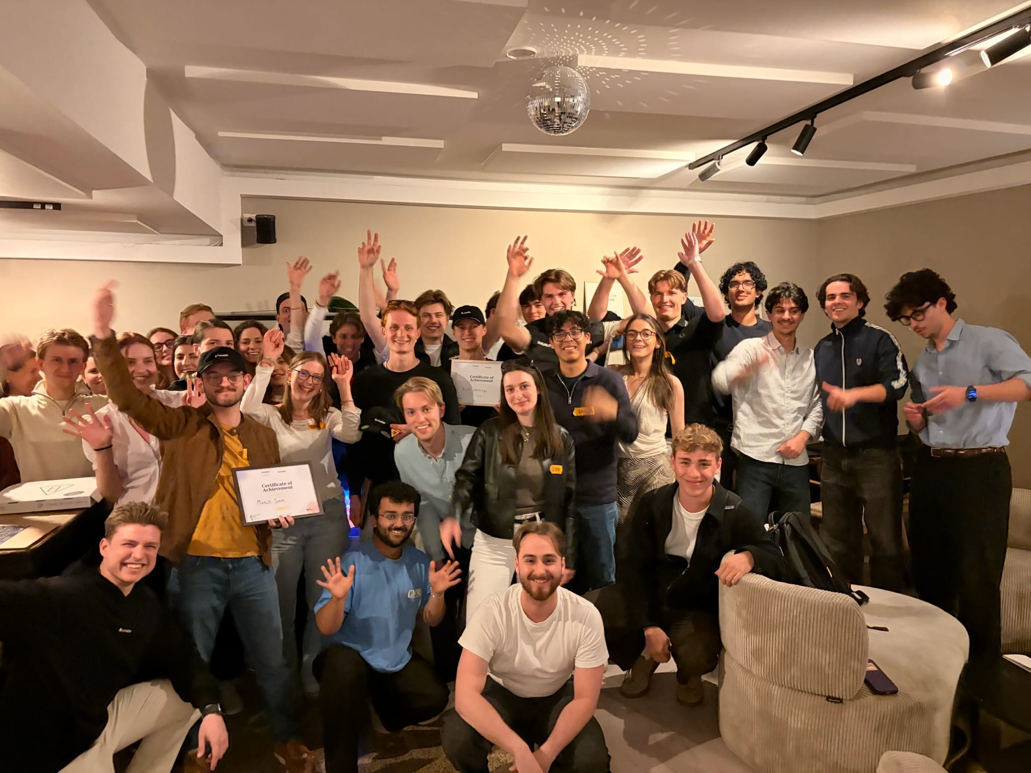A lively group of students cheering after a builders’ session